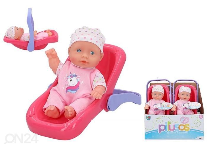 Nukke turvakaukalossa 20 cm kuvasuurennos