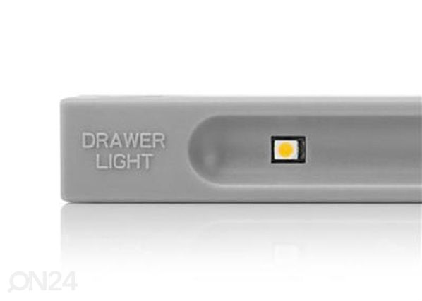 Valaisin tärinäanturilla